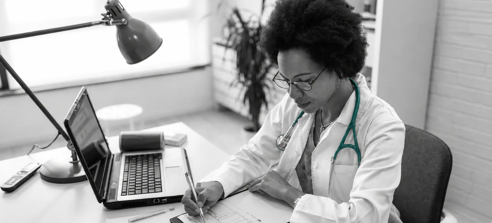 A medical billing specialist working at a computer