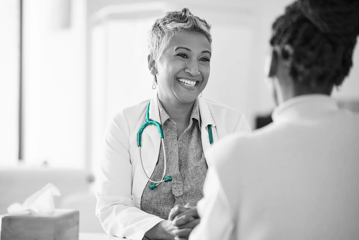 A physician in conversation with a patient during an office visit
